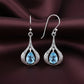Ocean Mist – Blue Topaz Teardrop Halo Earrings (925 Silver)